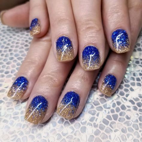 Stephanie Currid on Instagram: �“Royal blue and gold, makes me so happy 😁 #royalbluenails #goldnails #glitternails #ombrenails #glitterombre #nails #blingnails…” Sigma Gamma Rho Nail Designs, Royal Blue And Gold Nail Designs, Blue And Gold Ombre Nails, Blue And Gold Football Nails, Navy Blue And Gold Nails Short, Blue And Gold Sparkle Nails, Blue And Gold Gel Nails, Gold And Royal Blue Nails, Blue And Gold Nails Short