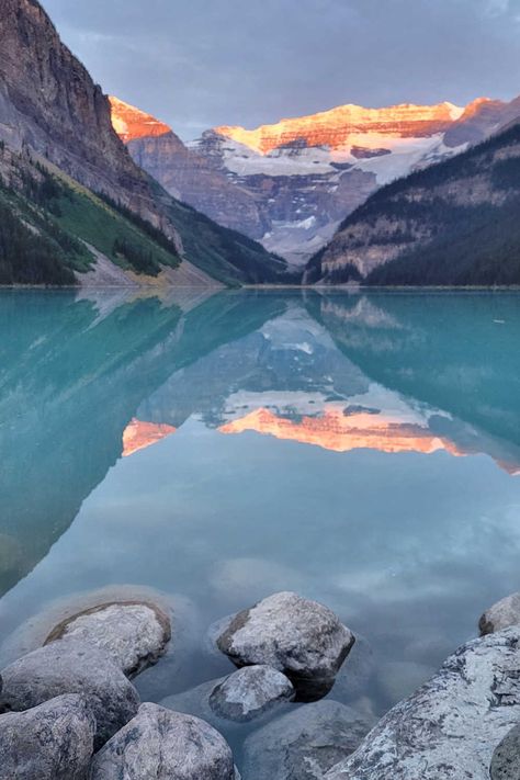 Lake Louise is a breathtakingly beautiful destination that would make for a perfect honeymoon. The turquoise blue waters of the lake, surrounded by snow-capped mountains, offer a stunning backdrop for romantic walks and leisurely picnics. You can also enjoy hiking, canoeing, skiing, and snowshoeing. The Fairmont Chateau Lake Louise provides luxurious accommodations, including spa services and gourmet dining options. Lake Louise offers a serene and romantic setting for a memorable honeymoon exper Fairmont Lake Louise, Canada Honeymoon, Honeymoon On A Budget, Fairmont Chateau Lake Louise, Chateau Lake Louise, Perfect Honeymoon, Romantic Honeymoon Destinations, Best Honeymoon Destinations, Banff Alberta