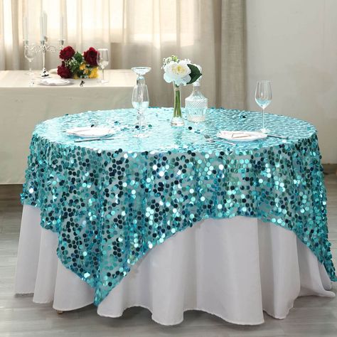 Quantity: 1 Overlay Material: Big Sequin on Mesh Base Color: Turquoise Size: 72 x 72 inches Sequin Size: 18mm 1pc design. InformationAdditional Information: Care Instructions: Do not dry clean or machine wash. Wipe with a soft damp cloth Uses: Wedding, Party, Event, Banquet, Decoration - Sequin Table Overlay 72"x72" Turquoise | Big Payette Topper - Weddings, Events By eFavormart Party Shop Wedding Table Overlays, Turquoise Wedding Decorations, Sequin Tablecloth, Sequin Table, Table Overlays, Bridal Table, Turquoise Wedding, Banquet Tables, Party Table Decorations