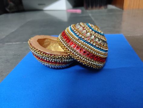 Kudukalu decoration for marriage or any events Coconut Designs For Marriage, Coconut Shell Decoration, Elephant Hair Jewelry, Decoration Things, Kalash Decoration, Lengha Blouse, Ganpati Decor, Coconut Decoration, Elephant Hair