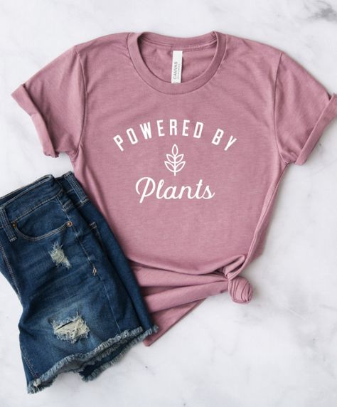 Vegan Shirt | Powered By Plants Shirt, Run on Veggies Shirt, Plant Based, Vegetarian Shirt, Herbivore Shirt, VeganThis unisex cut tee features "Powered By Plants" on front in faded white ink. Perfect tee for jeans, shorts & joggers. #vegan #veganlife Homebody Shirt, Lake Life Shirt, Vegan Cafe, Cross Shirts, Rodeo Shirts, Bride Shirt, Jesus Shirt, Vegan Shirt, Kindness Shirts