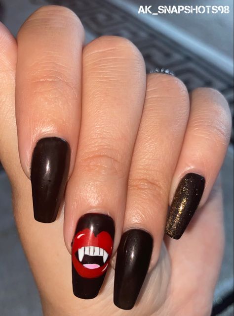 Here’s my Halloween Themed Nails! 🎃 I think you can all agree that Meg truly has done a FANGTASTIC Job @naileditbymegf This time I had Coffin Shaped Express Nail Extensions and Meg painted my Nails in a Black Nail Polish and she Hand Painted Nail Art of Vampire Teeth on both of my middle fingers and black and gold glitter on my thumb and pinkies. (I Absolutely LOVE them, they’re So Cool!) 🧛‍♀️❤️💅 I’m so lucky to have such an Extremely Talented Nail Technician As always a huge THANK YOU Meg! Halloween Themed Nails, Halloween Nails 2022, Express Nails, Hand Painted Nail Art, Themed Nails, Middle Fingers, Vampire Teeth, Black Nail Polish, Nails 2022