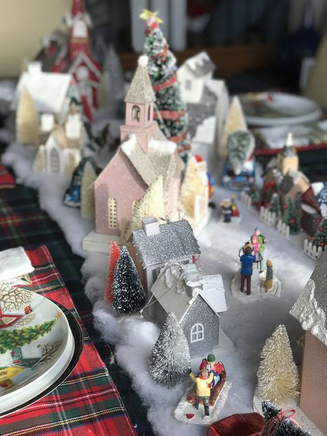 Christmas Village Tablescape Christmas Village Dinner Table, Christmas Village Tablescape, Christmas Village Table Centerpiece, White And Red Decorations, Village Tablescape, Christmas Village Table, Family Room Coffee Table, Red Decorations, Halloween Village Display