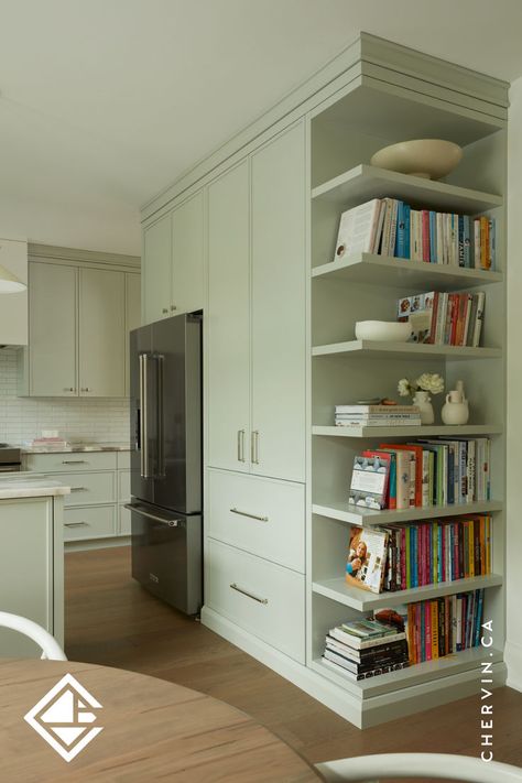 A transitional sage-green kitchen with an open shelving display for cookbooks. Green Oak Kitchen, Kitchen Cookbook Storage, Cookbook Display, Cookbook Storage, Cabinet Organizers, Kitchens Cabinets, Painted Cabinets, Ideal Kitchen, Charming Kitchen