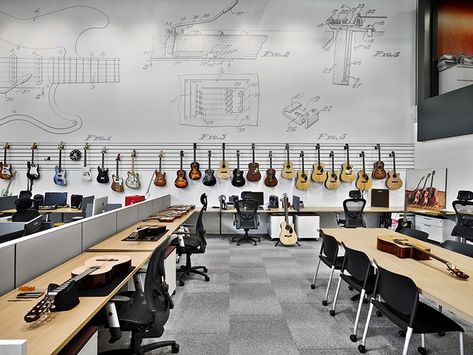 In the design studio at Fender Musical Instruments Corporation in Los Angeles, Rapt Studio. Installed pendant fixtures, made from recycled fluorescent tubes, and vinyl wall cove...