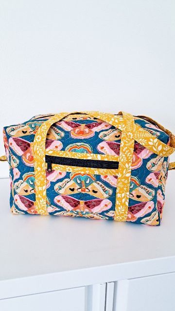 Kristina Brinkerhoff on Instagram: "Meet the Holland Duffle! The Holland Duffle has the same easy construction as the Holland Pouch pattern (all finished edges inside with no bias binding or curved seams! 🎉), just up-sized into a duffle with outer pockets and long handles. You can find the Holland Duffle pattern, along with Supply Requirements and more photos, in my pattern shop now. 🎉 Pattern: Holland Duffle available in my shop. Fabric: Curio from @rubystarsociety @modafabrics #centerstr Center Street Quilts, Pre Quilted Fabric, Handmade Fabric Bags, Sew Bags, Bag Tutorials, Travel Duffle Bag, Sac Week End, Bias Binding, Pouch Pattern