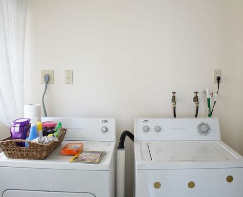 hide cords and hoses in the laundry room with this easy DIY Cover Hoses In Laundry Room, How To Hide Hoses In Laundry Room, How To Hide Washing Machine Hoses, Laundry Hose Cover, Hiding Laundry Room Hookups, Hidden Laundry Rooms, Basement Laundry Room Makeover, Dryer Hose, Stackable Laundry