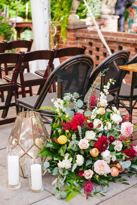 Burgundy, peach, champagne, and white fall wedding flowers at the back of the aisle. Photo by Jessica Hendrix Photography https://jessicahendrix.com/. Flowers by Robertson's Flowers & Events. Venue Morris House Hotel https://www.morrishousehotel.com/ White Fall Wedding, The Aisle Wedding, Alter Flowers, Flowers Photo, Fall Wedding Flowers, Guest Chair, Ceremony Flowers, Aisle Decor, Hendrix