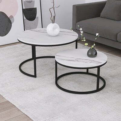 The modern coffee table set consists of two round tables, which provides plenty of space for drinking coffee or tea, reading books, displaying your favourite vases. Unique semi-circular metal frame design and the round tabletop give smooth and beautiful lines. Perfect for living room, bedroom, balcony, small spaces, etc. Expand round nesting coffee table set to get extra space and distribute the eco-friendly coffee table throughout the room individually or put them nested. | Mercer41 Round Marbl Vases Unique, Marble Coffee Table Set, Round Nesting Coffee Table, Unique Coffee Table Design, Round Nesting Coffee Tables, Central Table, Marble Round Coffee Table, Nesting Coffee Table, Tea Reading