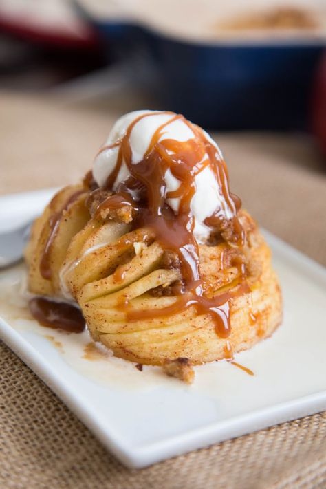 Meet Hasselback apples, the most impressive dessert you have to bake this fall. Crisps, crumbles, pies, and baked apples are all fine, but this is the one that really stands out in a crowd. Firm, sweet apples open like a fan, allowing the sweet cinnamon and brown sugar streusel to sink between each slice. Why not go all out and top this holiday-ready treat with a scoop of vanilla ice cream? Hasselback Apples, Impressive Desserts, Apple Desserts, Baked Apples, Fall Desserts, Eat Dessert, Fruit Desserts, Fruit Recipes, Apple Recipes