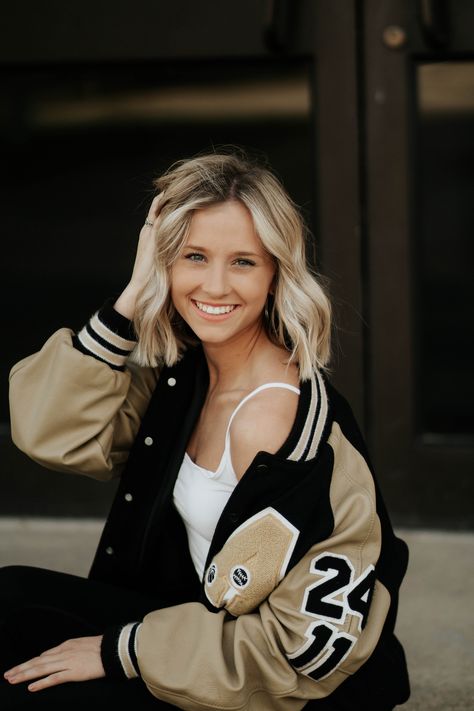 Senior Jacket Photoshoot, Senior Pictures At Night With Lights, Poses With Letterman Jacket, Leatherman Jacket Senior Pictures, Jersey Senior Pictures Photo Ideas, Senior Picture With Letterman Jacket, Letterman Jacket Outfit Senior Pictures, Senior Pics Letterman Jacket, Varsity Jacket Photoshoot Ideas