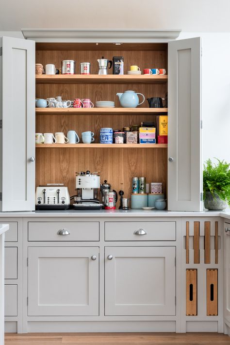 Organisation is key to keeping your kitchen clear & ready for food prep. This coffee and tea station means that the worktops are clear, wires and small appliances are hidden and the tea and coffee selections are clear to see. Inspired by Marie Kondo, this certainly sparks joy for us.   #ShereKitchens #KitchenStorage #KitchenDesign #CoffeeStation #ApplianceGarage #Oak #MarieKondo Kitchen Tea Station, Tea Station Kitchen, Breakfast Cupboard, Coffee Tea Station, Organised Kitchen, Tea Corner, Wood Kitchens, Kitchen 2021, Open Plan Kitchen Dining Living