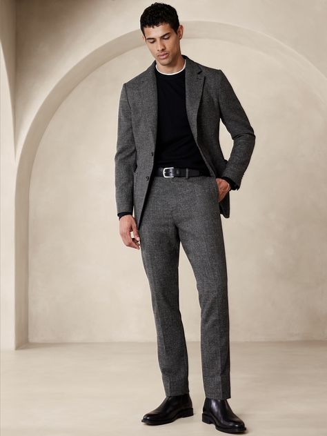 This pant is meticulously crafted from a blend of cotton and wool, woven for us in Italy to produce a texture that balances perfectly between tweed and twill.  Tailored Slim Fit: A modern slim fit, with a tapered leg and distinctive break at the hem.  Fabric from Italy's Marzotto mill.  Zip fly with button closure.  Belt loops.  Front and back pockets.  Coin pocket at wearer's right.  Lined to the knee.  Tailored Slim fit: A modern Slim fit, with a tapered leg and distinctive break at the hem. Suits For Tall Men, Grey Suit Men, Fall Suit, Blazer Outfits Men, Outfit Korean Style, Winter Suits, Classy Suits, Tweed Suit, Black Pants Men