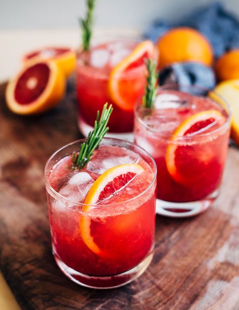 Non-Alcoholic Blood Orange Spritzers Aperol Spritz Mock Tail, Mocktail Aesthetic Dark, Mocktails Non Alcoholic New Years, Fresh Mocktail Recipe, Blood Orange Mocktail Recipes, Simple Mocktails, Blood Orange Mocktail, Rosemary Mocktail, New Year Reset