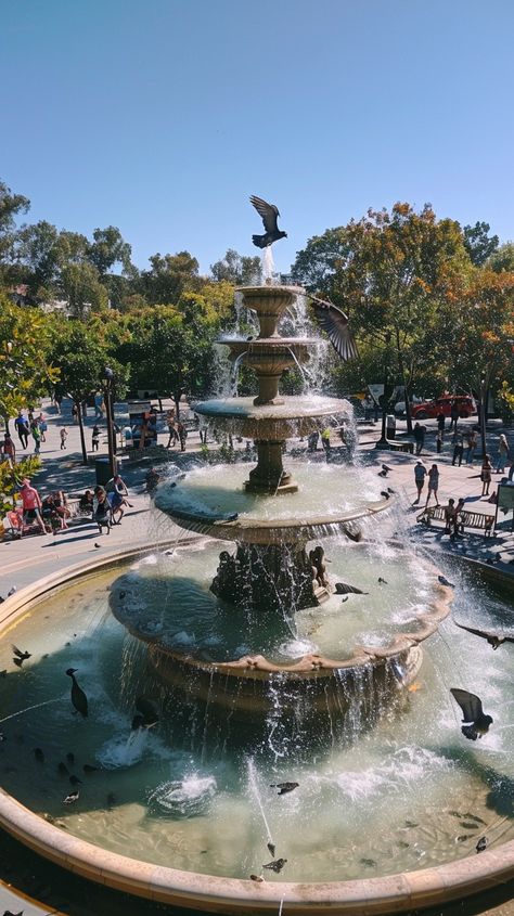 #Graceful Fountain Scene: A tranquil #fountain basks in the #sun, while #birds play in the #cascading #water amidst urban life. #city #aiart #aiphoto #stockcake ⬇️ Download and 📝 Prompt 👉 https://stockcake.com/i/graceful-fountain-scene_590312_1124255 Fountain City, Scene Image, Human Activity, Clear Blue Sky, Urban Life, Simple Beauty, Water Fountain, Urban Landscape, Nature Beauty