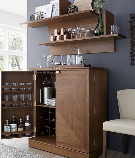 Parquet panels piece together gorgeous grain and color in this walnut bar cabinet that's ready to roll about the room for instant entertaining. With a flip and pull of the clean-styled brass hardware, the bar is open for business. Finished on all four sides, Maxine can float in a room. Its wood top folds out to an expanded work surface inset with black laminate. #homebar #barcabinetideas #bardecor Barrel Shelves, Loft Wall, Crate Shelves, Bar Storage, Home Bar Designs, Home Bar Furniture, Mobile Bar, Home Bar Decor, Coat Racks