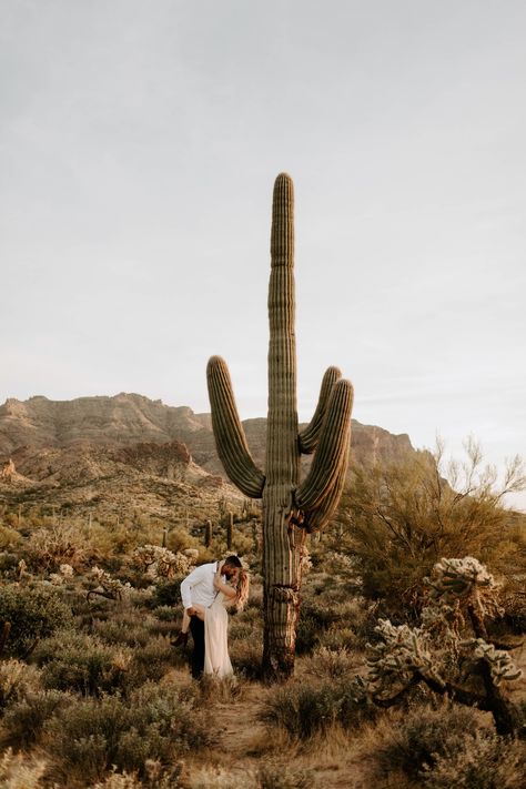 desert-engagement-session-with-saguaro-cactus-and-long-Flowy-dress Engagament Photos, Joshua Tree Engagement Photos, Arizona Desert Wedding, Desert Engagement Photos, Joshua Tree Engagement, Desert Photoshoot, Boho Desert, Superstition Mountains, Couple Engagement Pictures