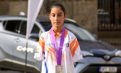 In an awe-inspiring display of indomitable spirit, Sheetal Devi, a 16-year-old armless archer, achieved an astounding victory at the Asian Para Games, claiming the Women's individual title. Her extraordinary performance in the finals against Singapore's Alim Nur, where she emerged triumphant with a score of 144-142, is a testament to her unwavering dedication and unmatched skill. This victory marked her second gold medal in this edition of the multi-sport event. Sheetal Devi, Image via Th... Resume Format Download, Multi-sport Event, Resume Format, Gold Medal, Sport Event, Awe Inspiring, First World, Victorious, Entertainment