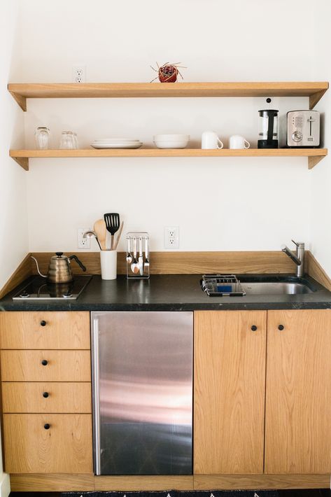 The kitchenette is clean, spare and, with its two-burner Miele stove, meant for light cooking. Kitchenettes Ideas Mini Kitchen, Kitchenette Ideas, Kitchenette Design, Minimalist Cottage, Small Kitchenette, Tiny Kitchen Design, Tiny House Kitchen, Kitchen Design Open, Studio Kitchen