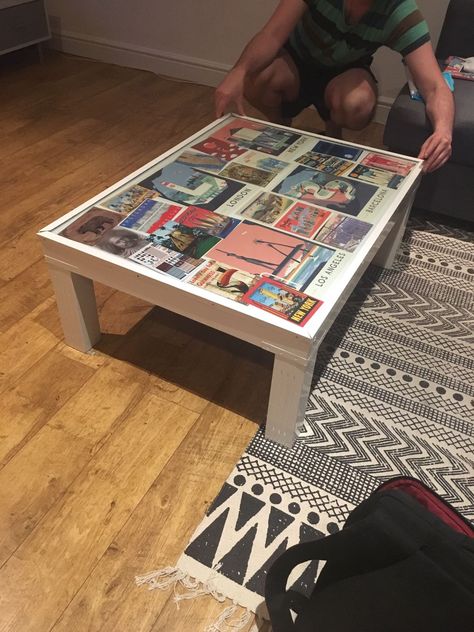 Upcycled coffee table covered in postcards Collage Coffee Table, Upcycled Coffee Table, Cassette Tape Table, Upcycle Playing Cards, Coffee Table Made From Old Books, Western Vanity, Playing Card Upcycle, Decoupage Coffee Table, Refurbished Coffee Tables