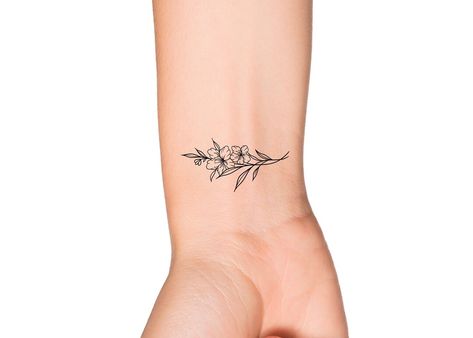 Dainty Floral Wrist Tattoo, Horizontal Wrist Tattoo, Fine Line Floral Wrist Tattoo, Dainty Floral Wrist Wrap Tattoo, Delicate Wrist Bracelet Tattoos For Women Flower, Wildflower Wrist Bracelet Tattoo, Inner Wrist Tattoos, Wrist Bracelet Tattoo, Wrist Flowers