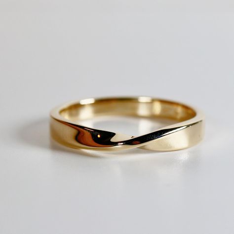 14k yellow gold Möbius wedding band ring. Matching stackable ring. The Möbius ring is a timeless symbol of eternity, with its single, seamless surface that twists back on itself. Inspired by the beauty of mathematics and the mysteries of the universe, this ring represents the infinite bond between love, life, and all the connections we share. Every Möbius ring is handcrafted to celebrate the enduring relationships that shape our lives. Just as its continuous loop has no beginning or end, it serv Mobius Wedding Band, Wedding Ring Infinity, Beauty Of Mathematics, Stackable Wedding Ring, Twisted Gold Ring, Mobius Ring, Twist Wedding Band, Stackable Rings Wedding, Ring Matching