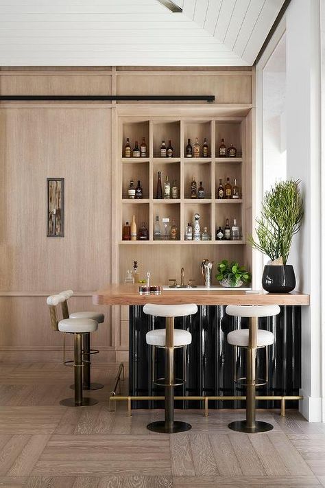 Home Bar With Island, Bar With Wood Countertop, Black Wet Bar, Gold Barstools, Ikea Laundry Room, Wooden Shelving, Blue Laundry Rooms, Wine Rooms, Home Wet Bar