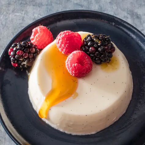 Buttermilk-Vanilla Panna Cotta with Berries and Honey | America's Test Kitchen Buttermilk Panna Cotta, Vanilla Panna Cotta, Caramel Chocolate Bar, Cookie Toppings, Caramel Tart, Cake Illustration, America's Test Kitchen Recipes, Make Ahead Desserts, Elegant Desserts