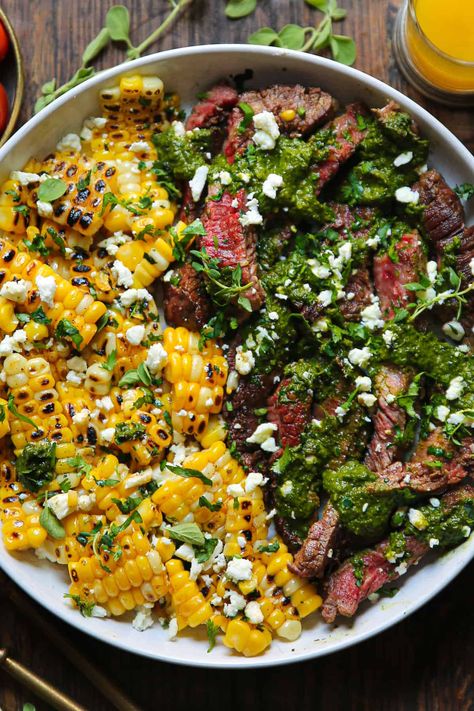 flank steak with corn, spinach sauce, and feta cheese - in a white bowl. Salads For The Week, Spinach Sauce, Pesto Dressing, Pan Seared Steak, Corn Pasta, Bacon Sausage, Yellow Corn, Cilantro Lime Chicken, Garlic Butter Chicken