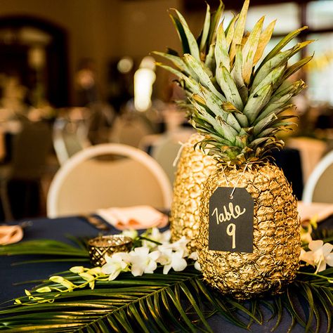 reception table decor, gold pineapple centerpieces, palm fronds, gold navy and green wedding colors, cielo at castle pines reception, colorado wedding inspiration, mountain wedding planner Gold Pineapple Centerpiece, Wedding Table Planner, Pineapple Centerpiece, Pineapple Wedding, Rustic Wedding Decorations, Luau Wedding, Fiesta Tropical, Green Wedding Colors, Pineapple Decor