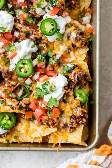 These Loaded Nachos with Turkey, Beans and Cheese are made with baked tortilla chips, lean ground turkey, black bean dip, cheese and pico de gallo. #nachos Ground Turkey Nachos, Turkey Nachos, Beans And Cheese, Baked Tortilla Chips, Loaded Nachos, Bean Dip, Nachos Recipe, Skinny Taste Recipes, Ground Turkey Recipes