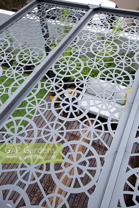 Overhead view of grey metal laser cut pergola roof showing the deck and seating area below. Ms Pergola, Pergola Roof, Roof Gardens, Fabrication Work, Iron Gate Design, Metal Pergola, Kitchen Pantry Design, Cnc Design, Pergola With Roof