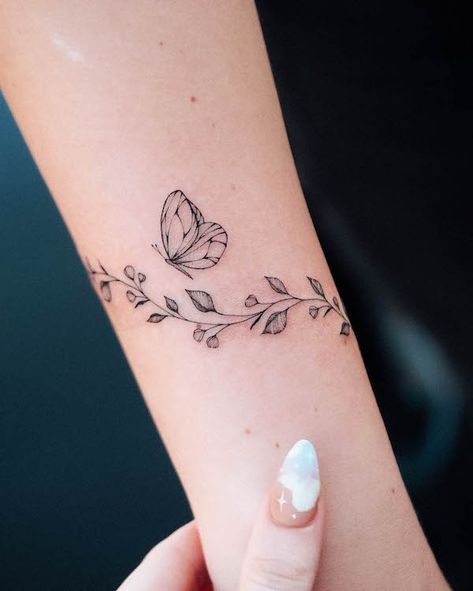 Butterfly floral bracelet tattoo by @bunami.ink Butterfly Bracelet Tattoo, Arm Wrap Tattoo, Wrap Around Wrist Tattoos, Bracelet Tattoos, Wrist Bracelet Tattoo, Wrap Around Tattoo, Butterfly Wrist Tattoo, Ankle Bracelet Tattoo, Wrap Tattoo