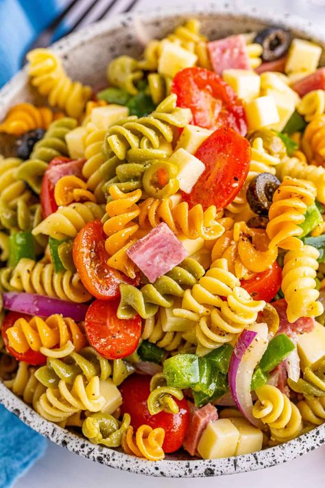 This easy tri color pasta salad is made with rotini, Genoa salami, fresh veggies, olives, and mozzarella cheese all tossed in a homemade Italian dressing. It’s the perfect side dish for potlucks and barbecues or to enjoy as an easy weeknight meal throughout the week. #pastasalad Tricolor Pasta Salad, Pasta Salad With Homemade Dressing, Color Pasta Salad, Taco Dinner Recipes, Tri Color Pasta Salad, Rotini Pasta Recipes, Salad With Homemade Dressing, Rotini Pasta Salad, Doritos Taco