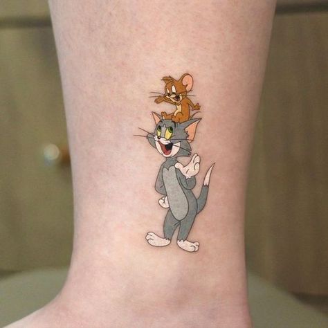 Tom And Jerry Tattoo Ideas, Tom And Jerry Tattoo, Jerry Tattoo, Twin Tattoos, Cartoon Tattoo, Mommy Tattoos, Galaxy Tattoo, Ribbon Tattoos, Cool Forearm Tattoos