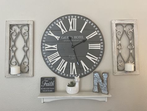 Wall With Big Clock Home Decor, Large Wall Clock Behind Couch, Wall Decor With Big Clock, Wall Decor Around Big Clock, Large Clock Wall Decor Entryway, Clock With Shelf Underneath, Decorating Around A Large Clock, Wall Clock Decor Living Room Over Tv, Gallery Wall With Large Clock