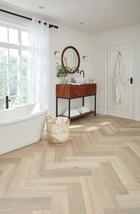 Texas White Ash LVP herringbone flooring shown in a contemporary bathroom, with soaking tub and wood accents, followed by a close-up angled image. Herringbone Vinyl Plank Flooring, Herringbone Bathroom Floor, Herringbone Lvt, Vinyl Plank Flooring Bathroom, Ash Wood Floor, Wood Vinyl Flooring, Wood Floor Bathroom, Vinyl Flooring Bathroom, Vinyl Wood Flooring