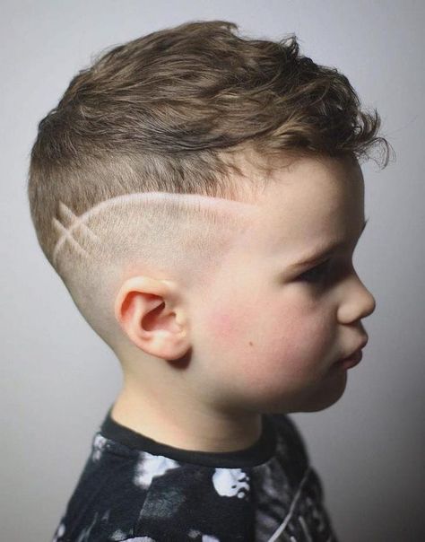 long-hairstyles-for-boys-dark-blonde-hair-undercut-black-shirt-white-background Toddler Boy Haircut With Design, Simple Hair Designs For Boys, Baseball Design Haircut, Boys Barber Haircut, Boys Haircut With Lines, Mid Fade Designs, Mid Fade With Design, Boys Haircut With Design On Side, Boys Hair Designs Lines