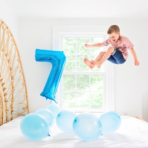 Creative birthday photo shoot with balloons 7 years old boy jumping on bed 7year Birthday Party Ideas, 7th Birthday Photoshoot Ideas Kids Boys, 7 Year Birthday Party Ideas Boy, Boys Birthday Party Activities, 7th Birthday Party For Boys, Birthday Photoshoot Ideas Boys, Boy Birthday Pictures, 7th Birthday Boys, Photoshoot Boy