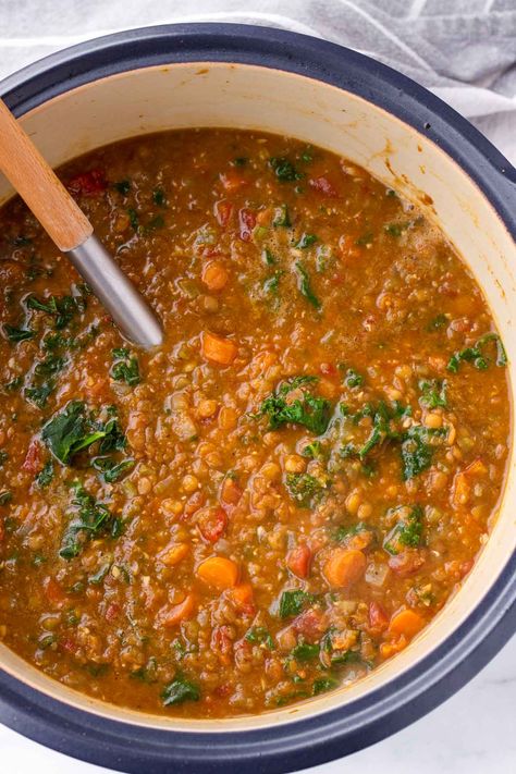 Upgrade your lentil soup game with this flavorful Lentil Kale Soup! Loaded with aromatic spices, hearty lentils, and nutritious kale and carrots, it's perfect for a nourishing meal. This lentil soup is meal prep and freezer friendly. Red Lentil Kale Soup, Kale Lentil Soup Crock Pot, Lentils And Kale Recipe, Kale Lentil Soup, Lentil Kale Soup, Lentil Kale, Vegan Family Dinner, Quinoa Kale, Quinoa Soup