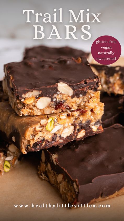 These deliciously crunchy, salty-sweet Trail Mix Bars make the best healthy snack! They are made with a variety of nuts and seeds, dried cranberries, and crispy quinoa mixed with natural peanut butter, coconut oil, maple syrup, and vanilla and then topped with a layer of melted chocolate. These naturally sweetened bars are gluten-free, vegan! Homemade Salty Snacks, Honey Nut Bars, Sweet Trail Mix, Trail Mix Bars, Nut Free Snacks, Healthy Trail Mix, Crispy Quinoa, Healthy Snack Bars, Plant Based Breakfast