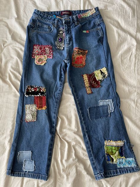 Patched with vintage fabrics and patches machine wash.  All jeans have been pre-washed  and dried again after patches have been added. Side note: The legs of jeans have been opened up for the sewing machine to have better access for sewing patches on. Then the legs were double stitched back up. This may take a quarter inch off each leg.   Also take in account these are used jeans, some of these jeans may have shrunk.  Note the brand of the jeans and google their size chart and possible shrinkage Cute Patches For Jeans, Cute Jean Patches Ideas, Fabric Patches On Jeans, Flower Patch Jeans, Vintage Patchwork Jeans, How To Add Patches To Jeans, Clothing With Patches, How To Sew Patches On Jeans, Sewing On Jeans