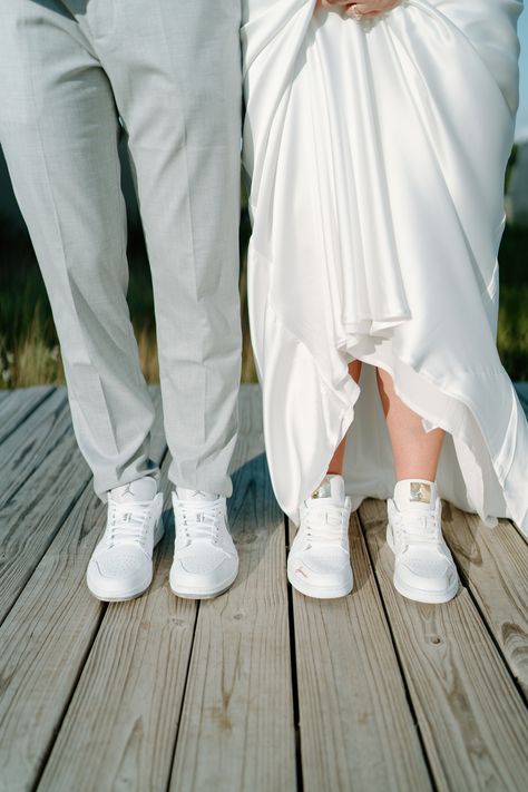 This is a picture of a bride and groom wearing custon Nike wedding shoes for their wedding Matching Shoes Wedding Couple, Bride And Groom Shoes Photography, Wedding Matching Shoes, Bride And Groom Nikes, Matching Wedding Shoes Bride And Groom, Bride And Groom Matching Shoes, Matching Wedding Shoes, Nike Wedding Shoes, Bride And Groom Shoes