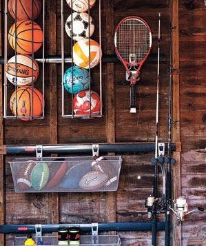 The Solution: Divvy Up the Duties | Pros weigh in on how to tackle five everyday issues when it comes to clutter control. Sports Equipment Organization, Sports Equipment Storage, Sports Storage, Clutter Control, Garage Storage Shelves, Garage Organize, Ball Storage, Astuces Diy, Equipment Storage