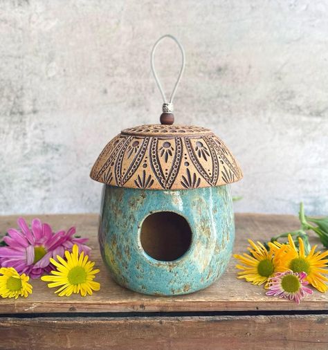 Cedarwood Ceramics on Instagram: “Stringing up the new bird feeders!! Bird houses too🪺🏡 We’ll be restocking the shop with lots of spring goods this Saturday! (April 1st at 5…” Clay Bird Houses, Clay Bird Feeder, Spring Pottery Ideas, Ceramic Bird Feeders, Pottery Bird Feeders, Pinch Pot Bird Feeder, Ceramic Birdfeeders, Ceramic Bird Feeder, Pottery Bird Feeder