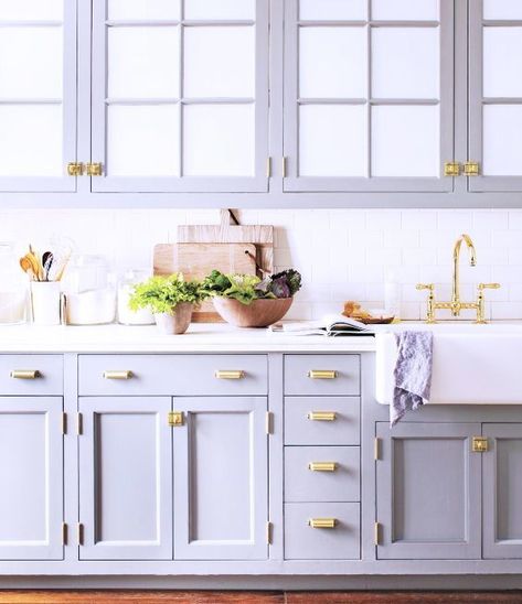 These lilac kitchen cabinets have a gray-blue cast that is warmed by the brass faucet and kitchen hardware. If you want to try this at home, use Velvet Scarf, and to keep your room from feeling cold, add warm, metallic finishes and accessories. #purple #kitchen #cabinets #paint #interiordesign #homedecor Lilac Kitchen, Blue Gray Kitchen Cabinets, Grey Blue Kitchen, Kitchen Ikea, Painted Kitchen Cabinets Colors, Kabinet Dapur, Gray Cabinets, Farmhouse Kitchen Cabinets, Classic Kitchen