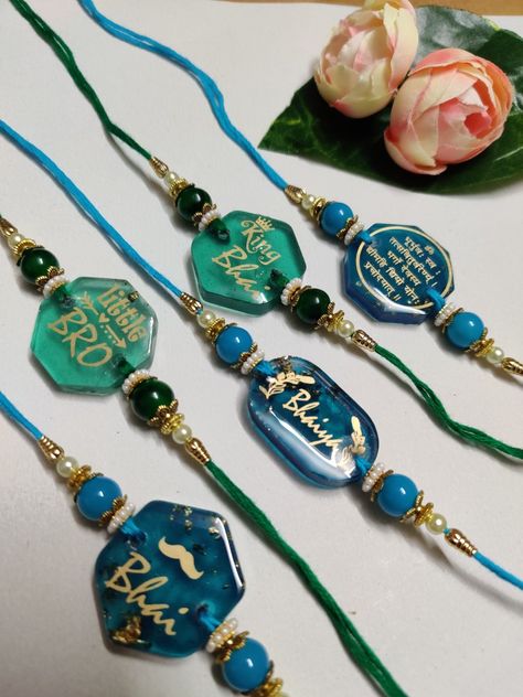 Customise your Rakhi.. Resin rakhi Couple rakhi Resin Rakhi Making, Rakhi Resin Art, Resin Art Rakhi Designs, Couple Rakhi Designs, Resin Art Rakhi Ideas, Resin Rakhi Designs Handmade, New Rakhi Designs 2023, Rakhi Rasin, Resin Rakhi Designs