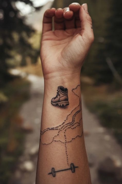 Hiking boot tattoo on forearm with mountain trail design. Hiking Boot Tattoo, Outdoors Tattoos For Women, Wrist Tattoo Designs For Women, Boot Sketch, Women Tattoo Inspiration, Boot Tattoo, Tattoo Ideas For Females, Wrist Tattoo Designs, Unique Wrist Tattoos