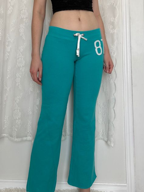 Low Rise Tracksuit, Teal Aesthetic Outfit, Low Rise Sweatpants Outfit, Flare Sweatpants Outfit, Teal Pants Outfit, Flare Sweat Pants, Aeropostale 2000s, Aeropostale Outfits, Low Rise Sweatpants