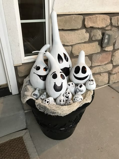 Gourd ghosts. I had a ton of extra gourds from my garden, so I spray painted them with flat white paint and the kids and I added faces with black sharpie. Ghost Gourd Painting, Diy Painting Gords, Painted Ghost Gourds, Fall Painted Gourds, Painted Gourds Ideas Halloween, Crafts With Gourds, Gourd Painting Ideas Halloween, Gourd Bowls Ideas, Halloween Painted Gourds